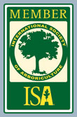 Green membership badge with ISA logo and tree emblem inside a circular seal.