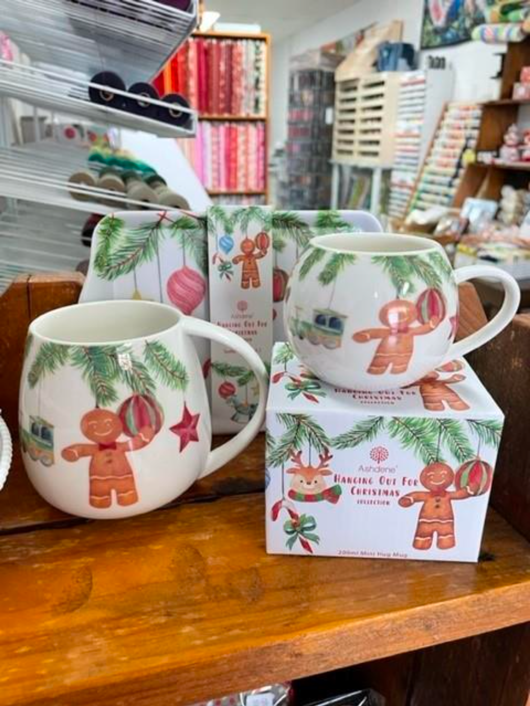 Two Mugs With Gingerbread Men on Them Are Sitting on a Wooden Shelf — Lyn-Jelle Crafts in Emu Park, QLD