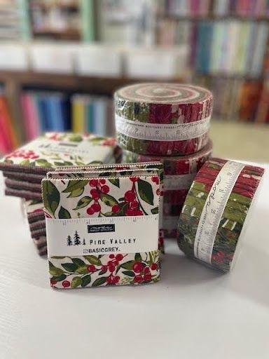 A Bunch of Rolls of Fabric Are Stacked on Top of Each Other on a Table — Lyn-Jelle Crafts in Emu Park, QLD