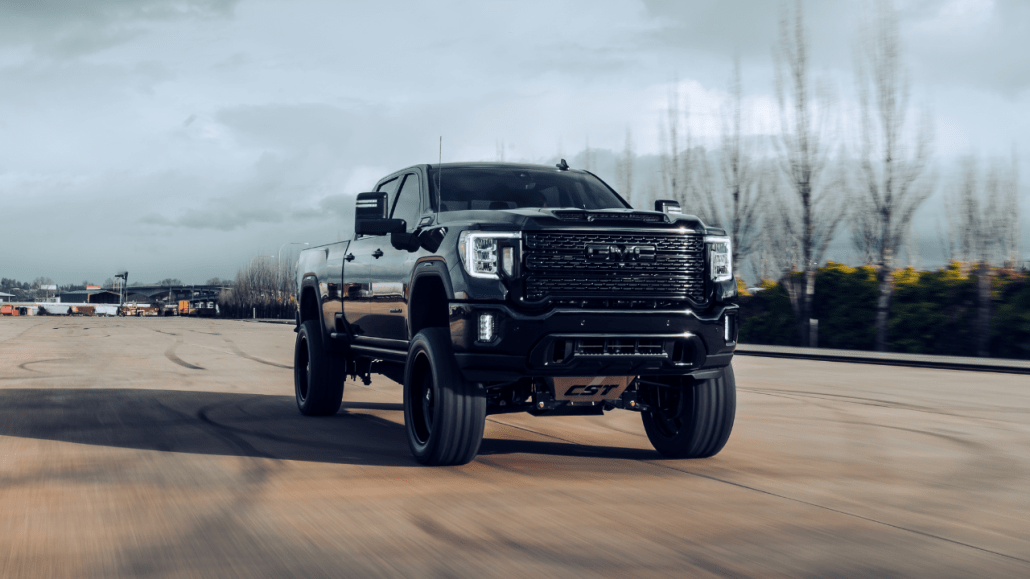 ford diesel truck on a dirt road