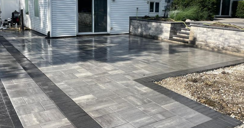 Unilock Beacon hill Smooth patio - pool deck with Quarry Smooth Retaining wall wall and steps installed in Hoffman estates IL