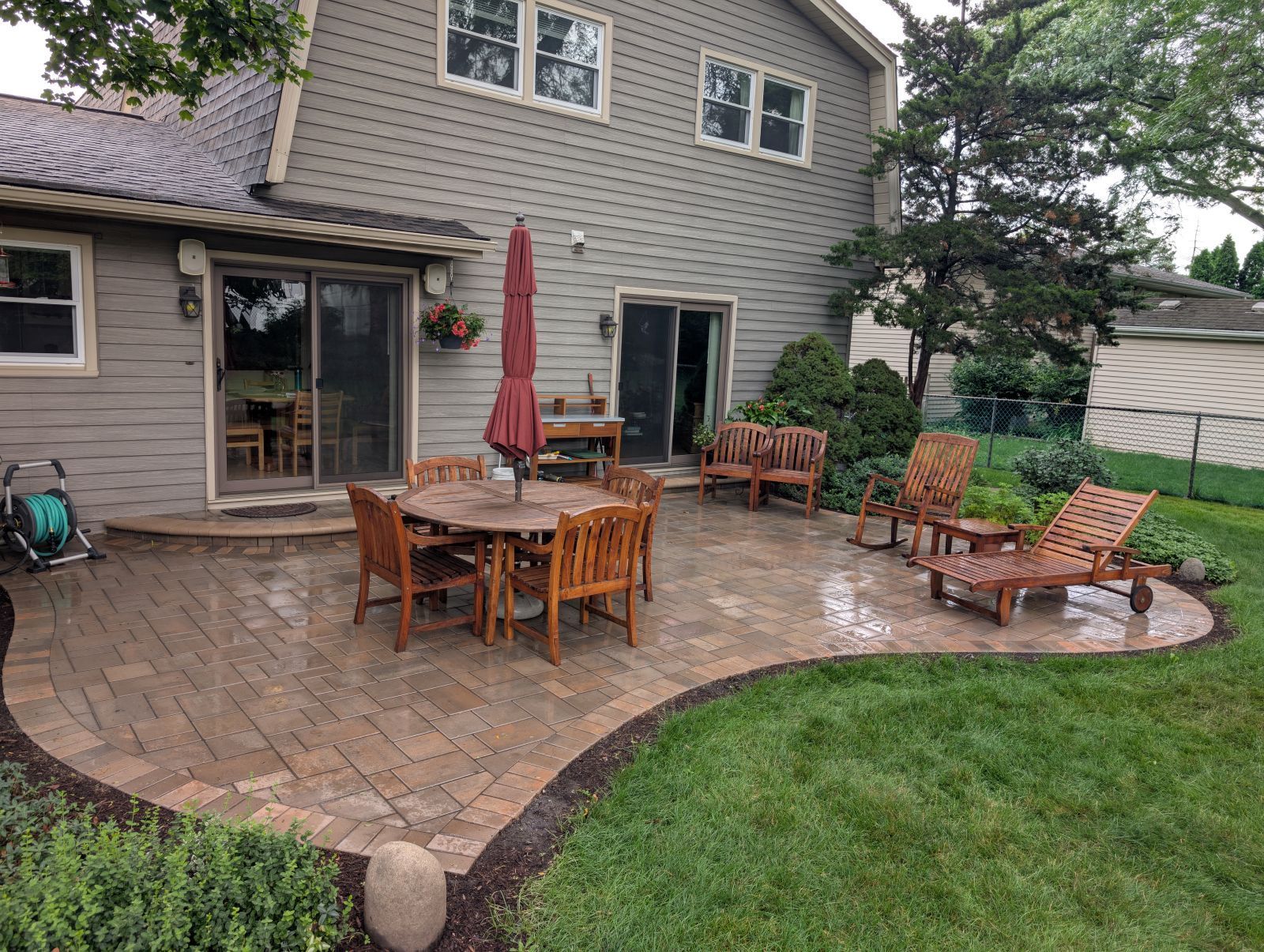 Rounded brick paver patio installed in Downers Grove IL