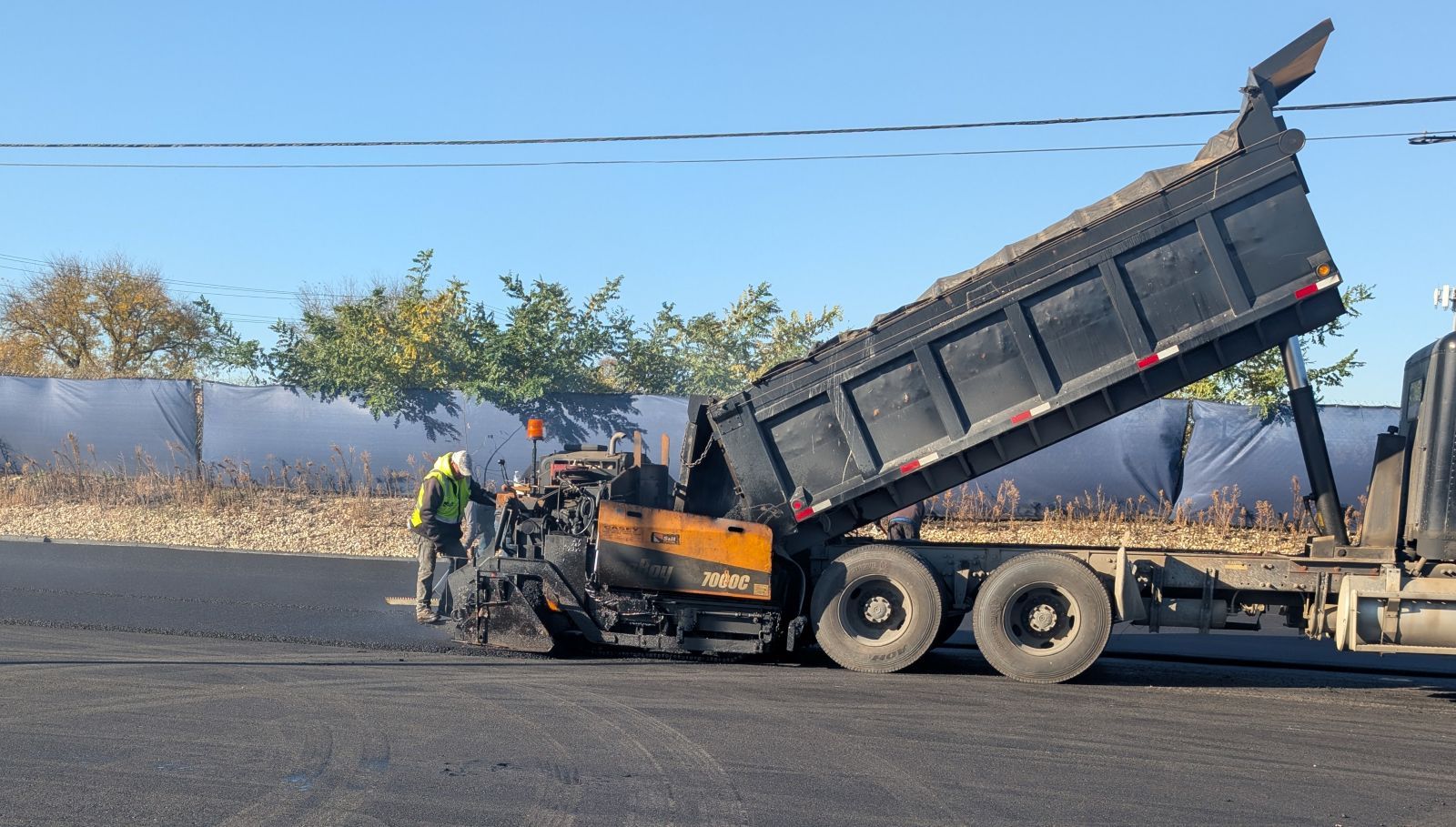 TMW Enterprises Paving & Maintenance workers paving parking lot in Elk Grove Village IL