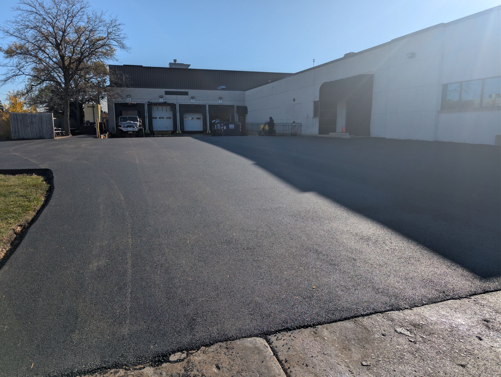 Newly paved asphalt loading dock for a business in the industrial business park in Elk Grove Village, IL.