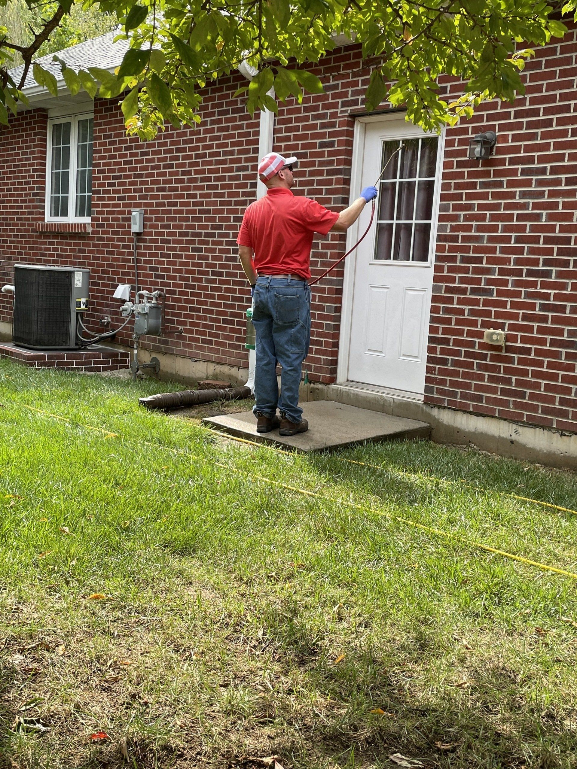 Man doing pest control — Jefferson City, MO — Art’s Pest Control