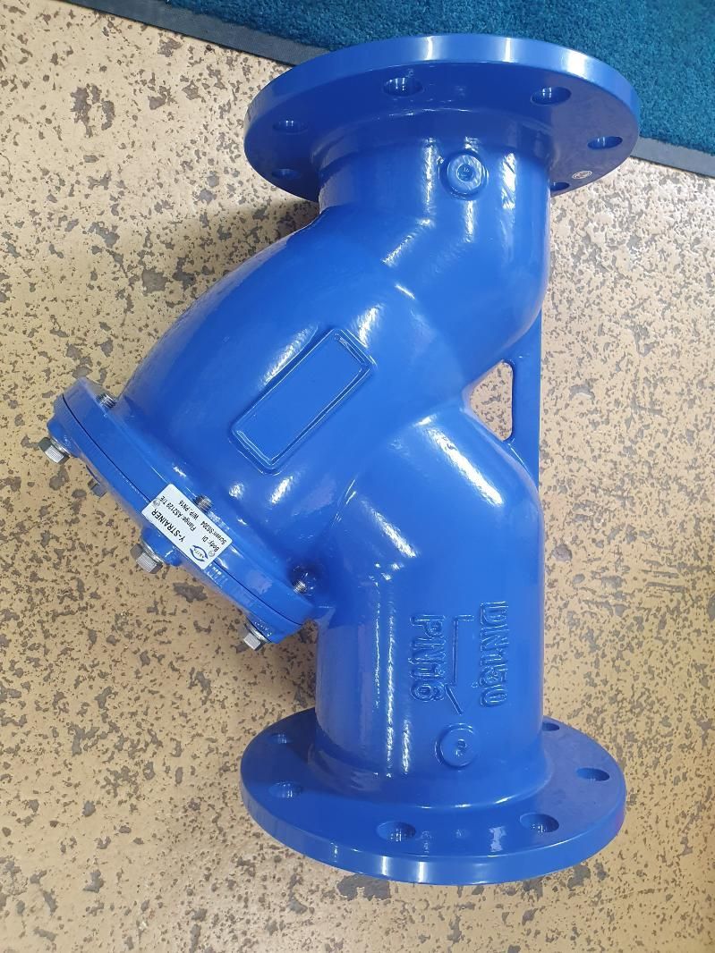 A Blue Pipe with A Flange Is Sitting on The Floor — Peel Irrigation & Water Supplies in Taminda, NSW
