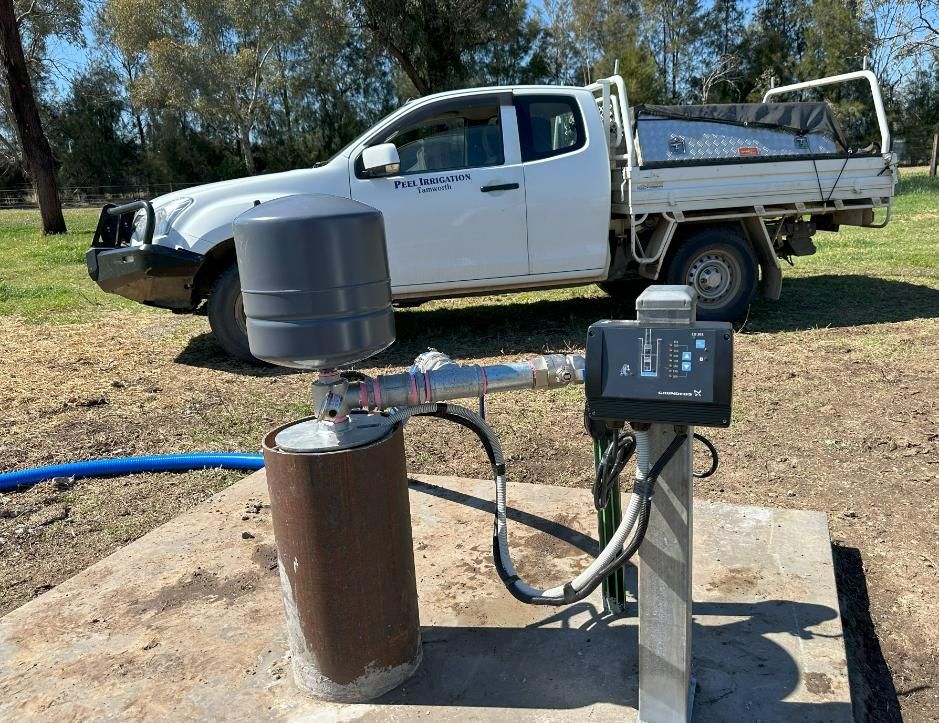 White Truck is Parked Next to a Water Pump — Peel Irrigation & Water Supplies in Taminda, NSW