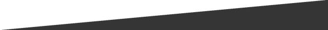A close up of a black triangle on a white background.