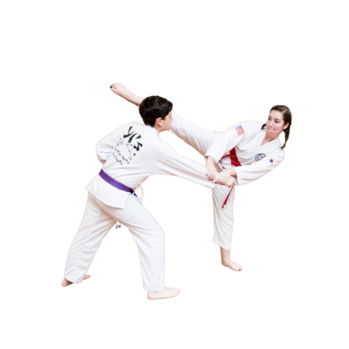 two adults sparring in martial arts