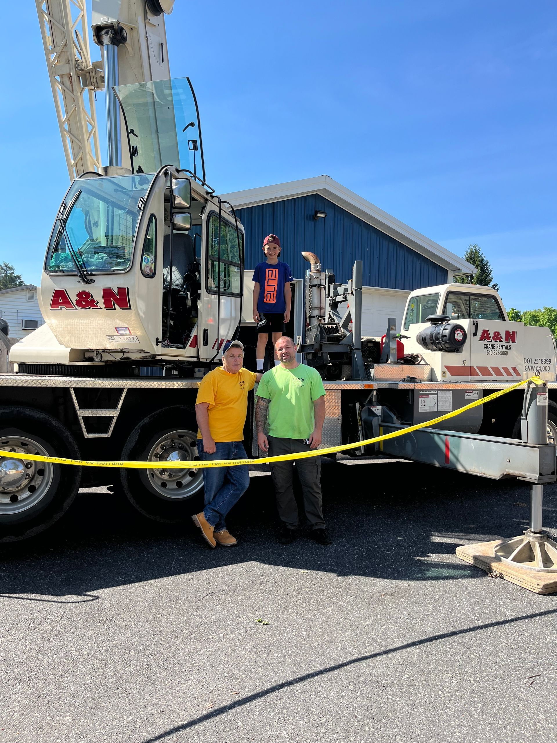 Nick Crocetto Sr, Nick Crocetto Jr, and Nick Jr's son are standing in front of an A&N Crane Rental crane truck.