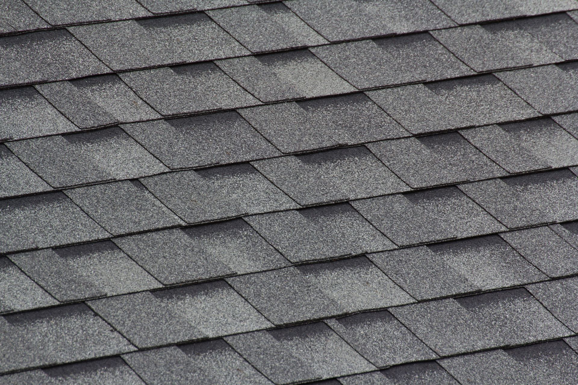 A close up of a roof with shingles on it.