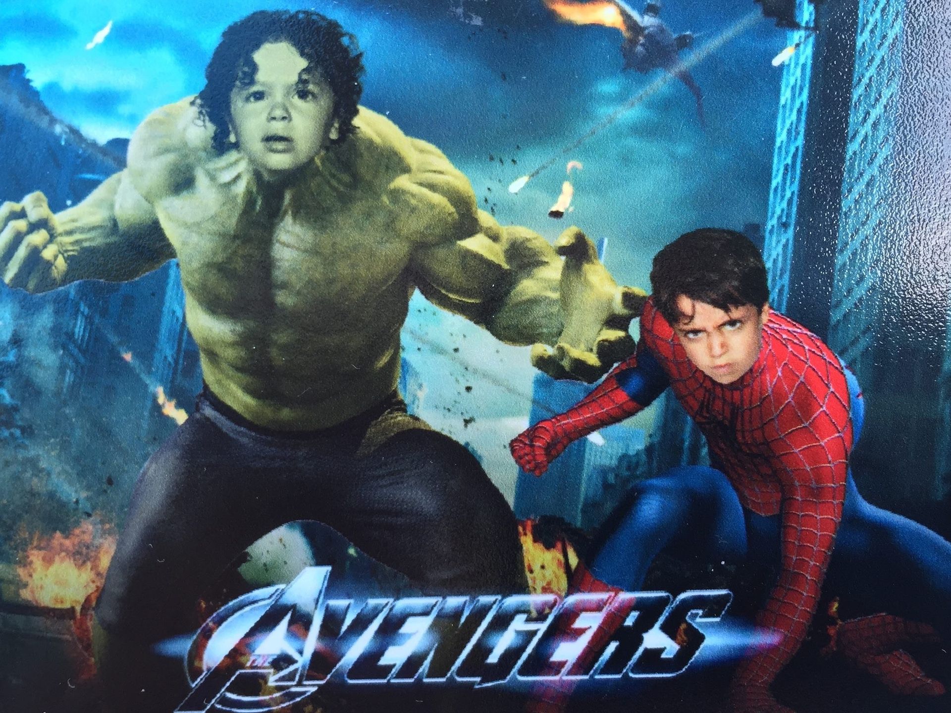 Child dressed as Hulk and Spider-Man with