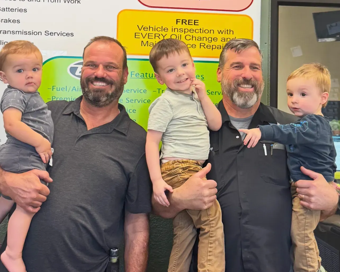 Family Photo Inside Auto Shop | Engines Express