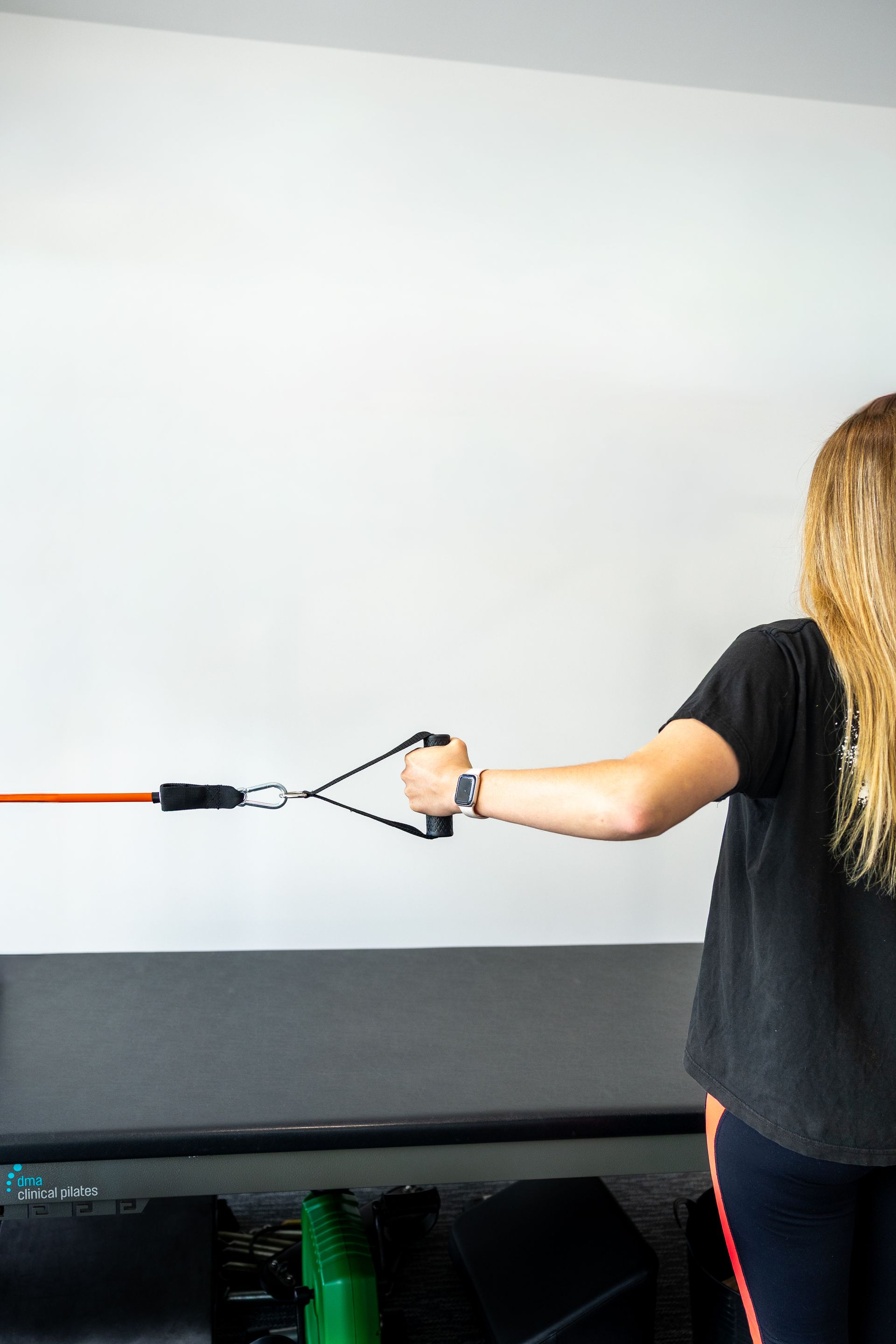 Therapist Examining Patient's Wrist in a Brace — Forerunner Physio In Taree, NSW