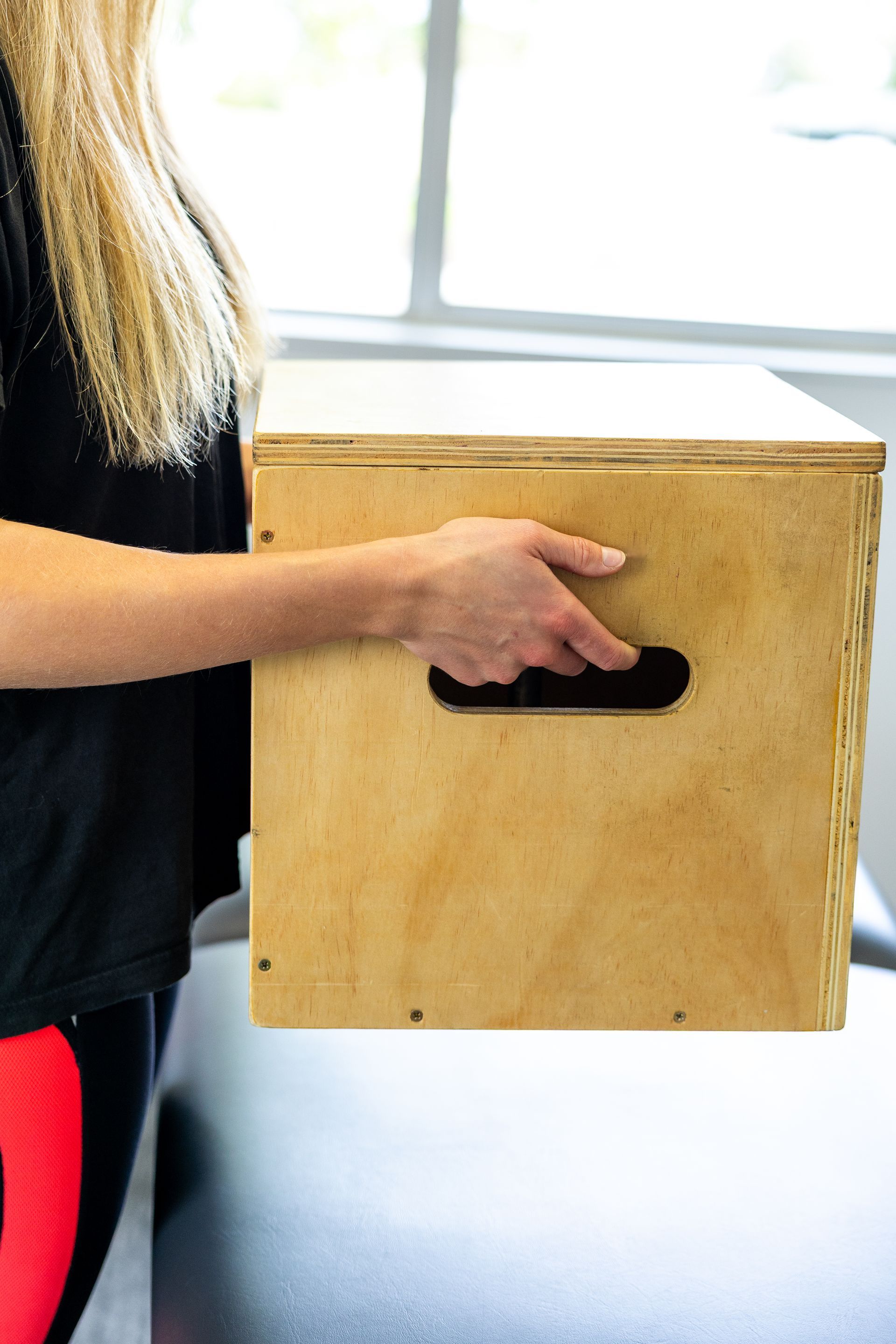 A Person's Lower Back is Being Examined — Forerunner Physio In Taree, NSW