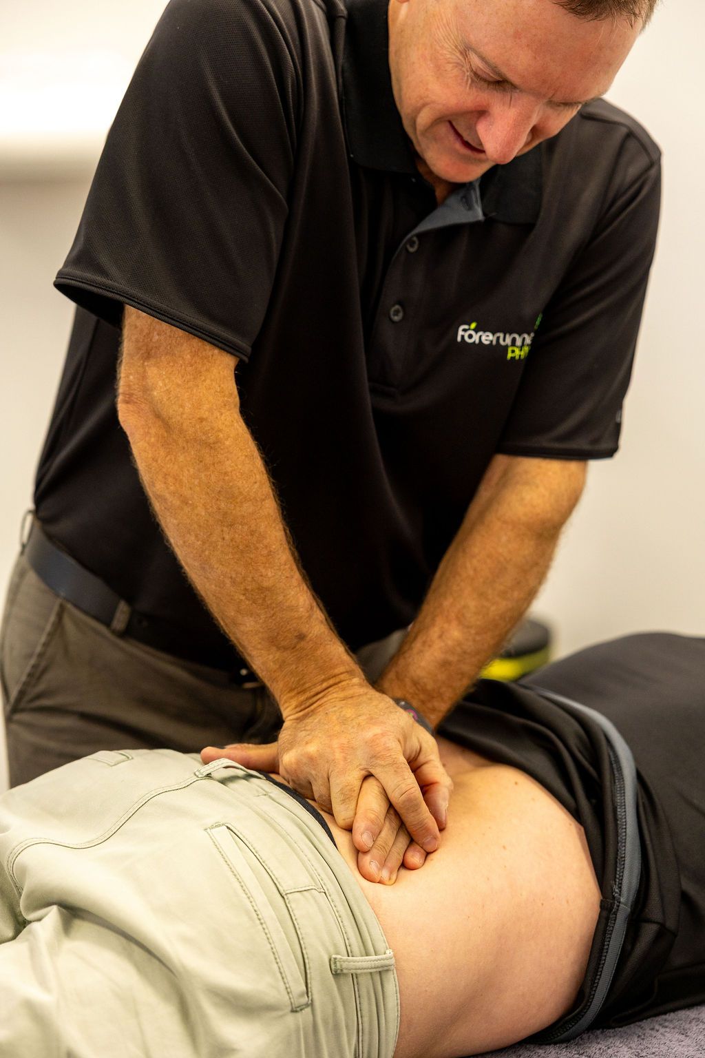 Therapist Stretching Patient's Arm — Forerunner Physio In Taree, NSW