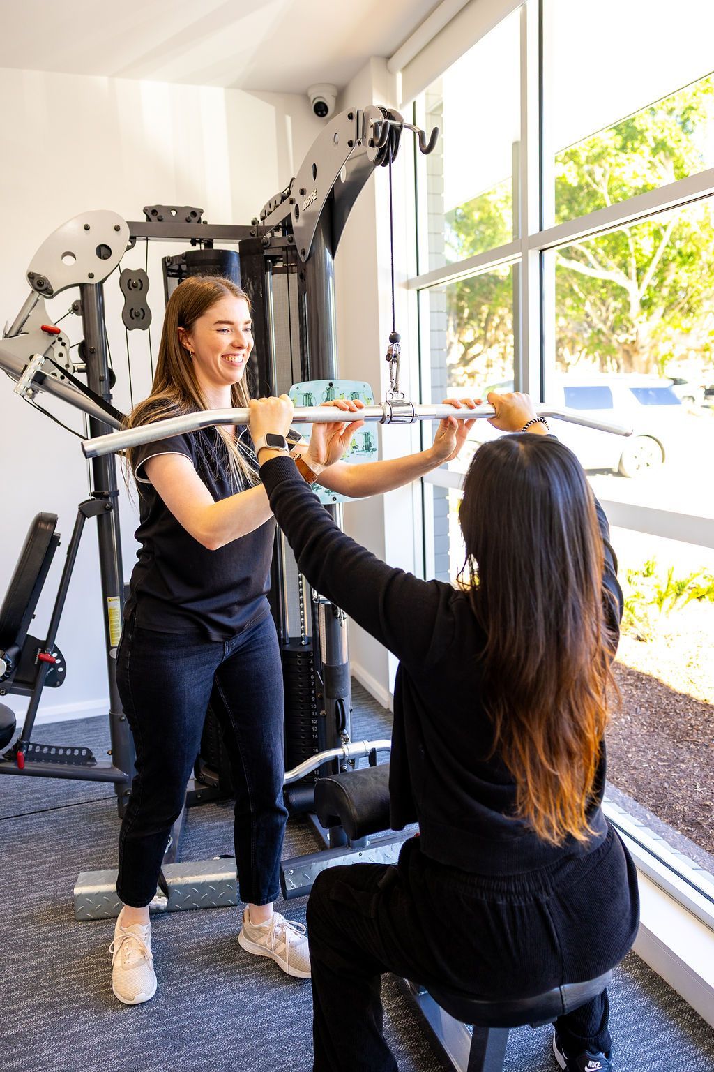 Woman Exercising on a Pilates Machine — Forerunner Physio In Taree, NSW