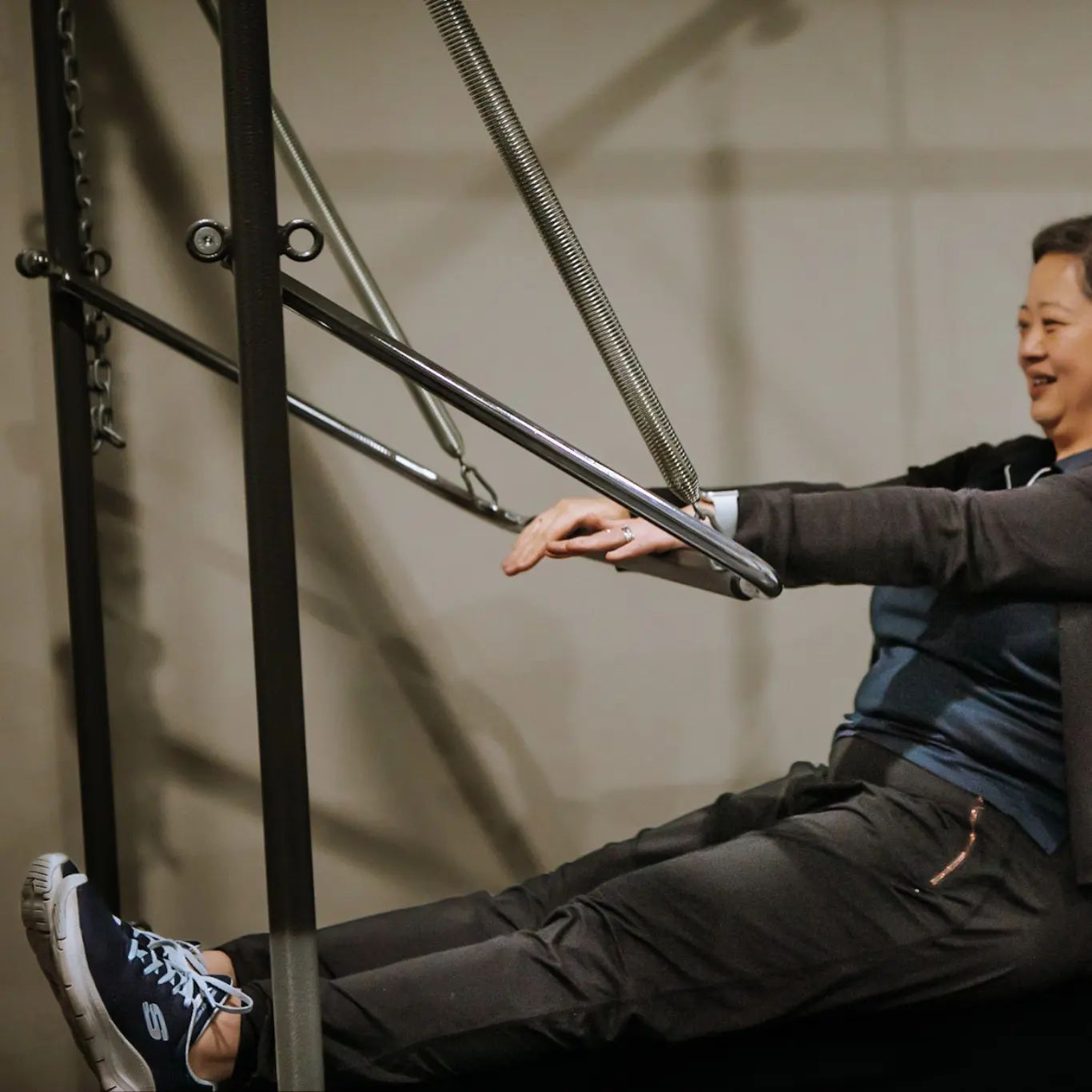 Woman Using a Pilates Machine — Forerunner Physio In Taree, NSW