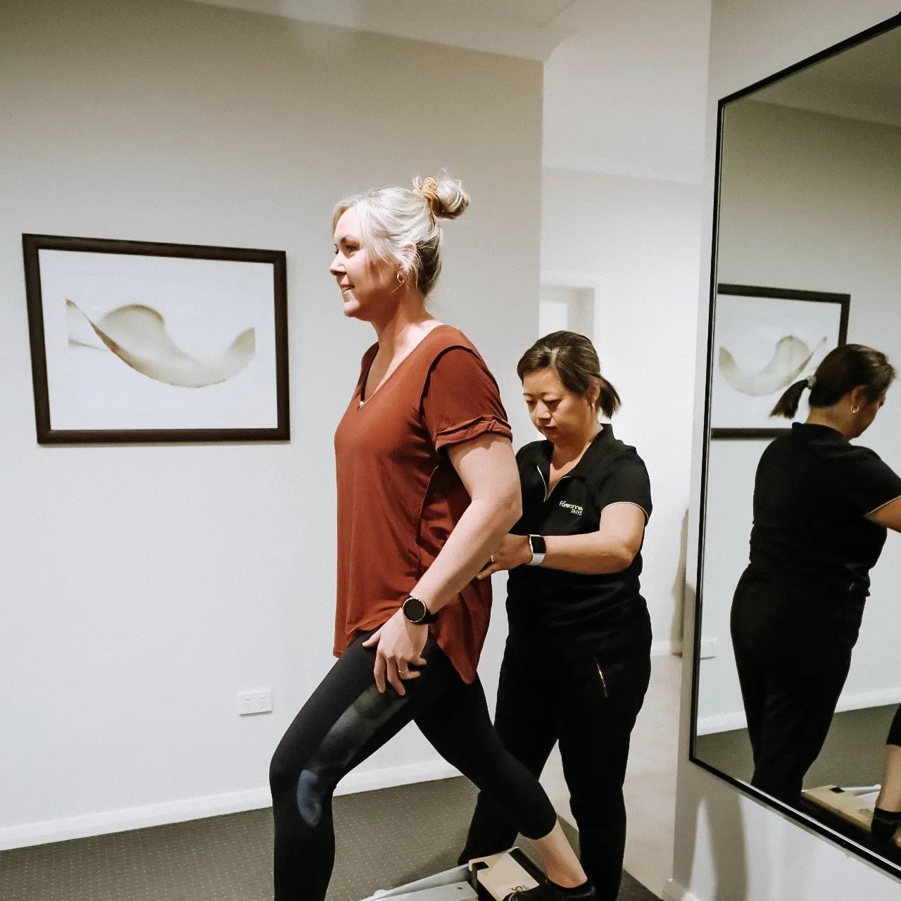 Woman Exercises With Assistance — Forerunner Physio In Taree, NSW