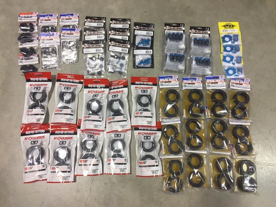 Overhead Shot Of Numerous Small, Packaged Black Rubber Tires And Parts — Midtown Hobbies In Lismore, NSW