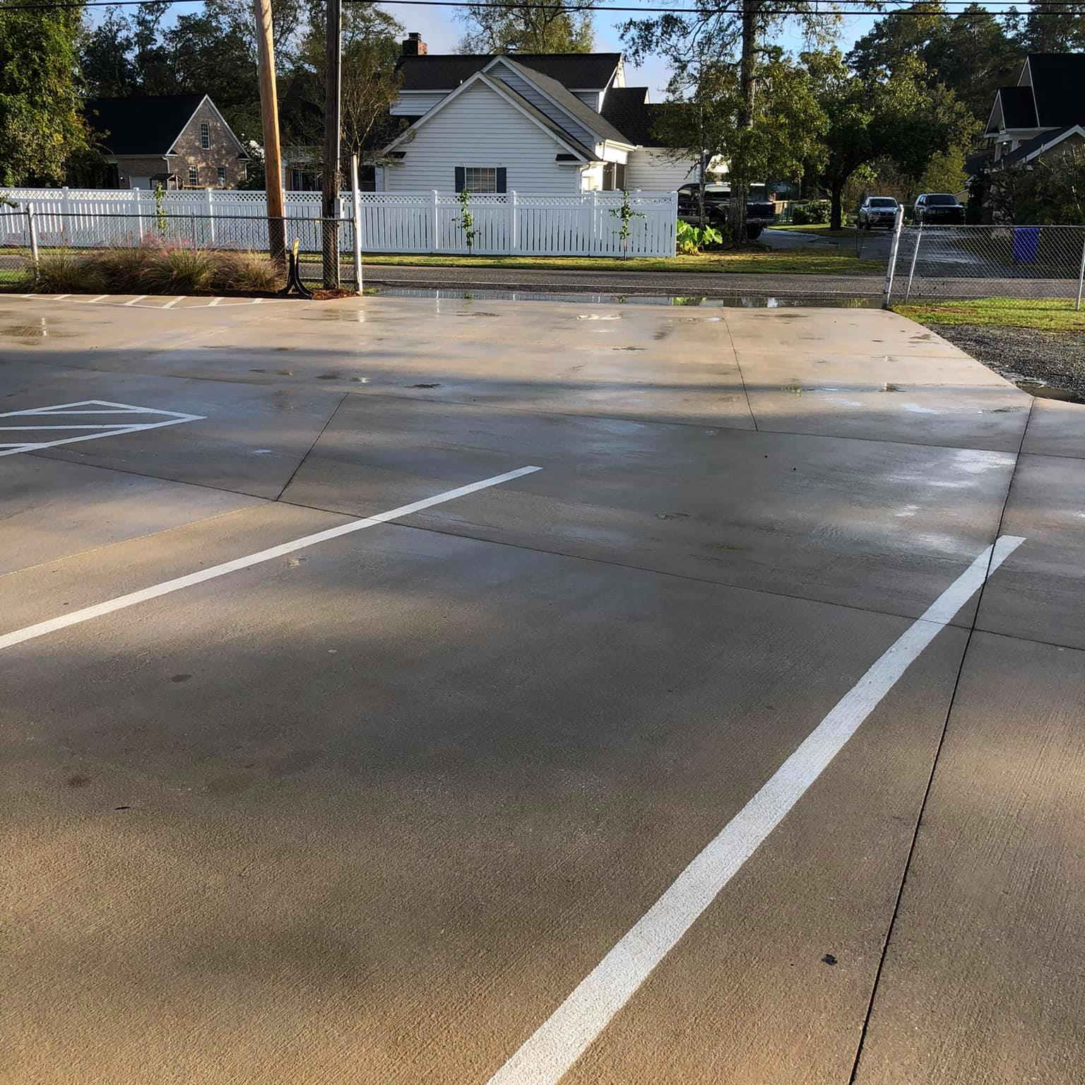 A parking lot with a handicapped sign on the side
