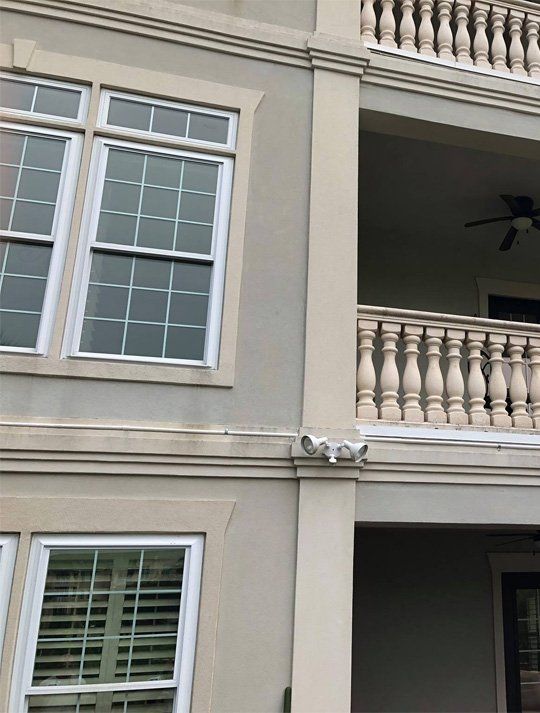A building with a balcony and a lot of windows
