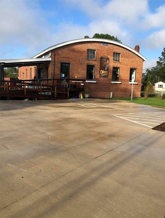 A large brick building with a ramp in front of it