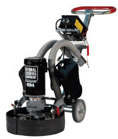 Floor grinder with a black body, two hoses, and a red handle.