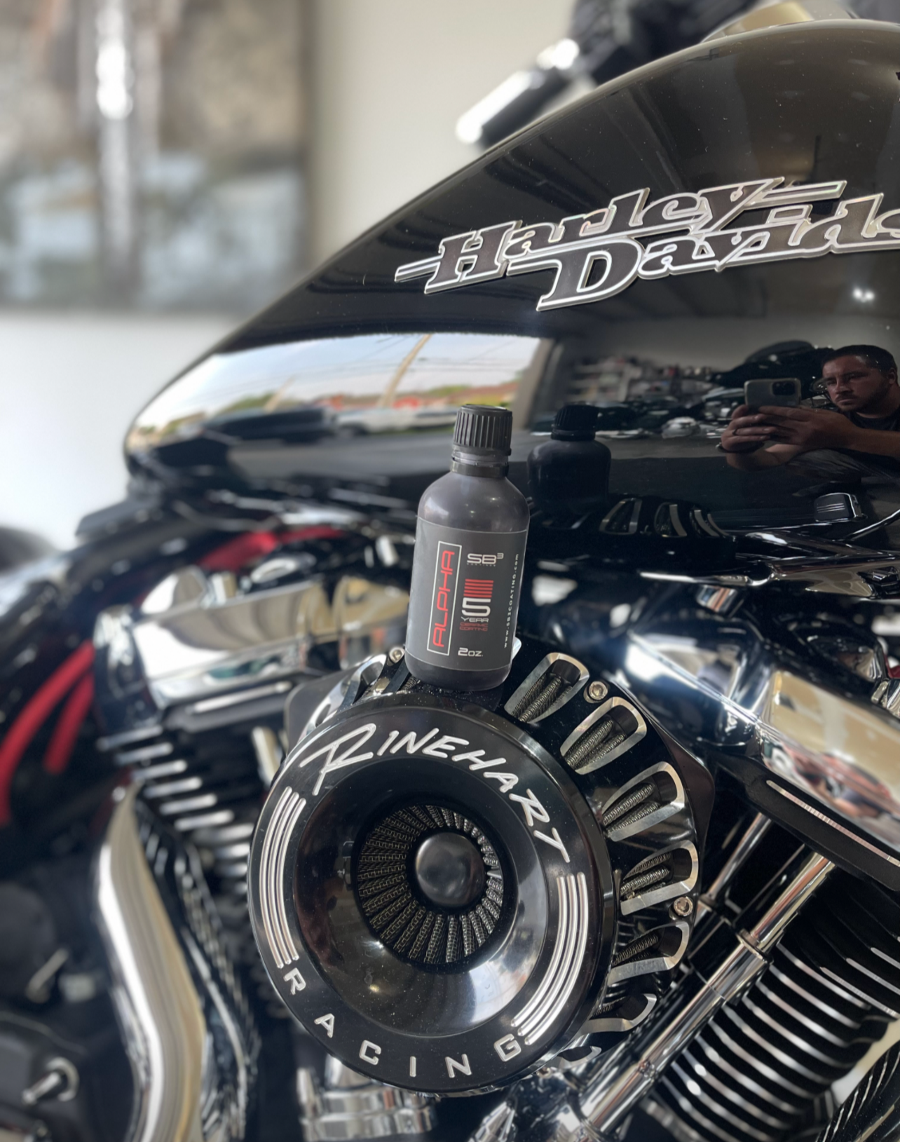 a harley davidson motorcycle is parked in a garage .