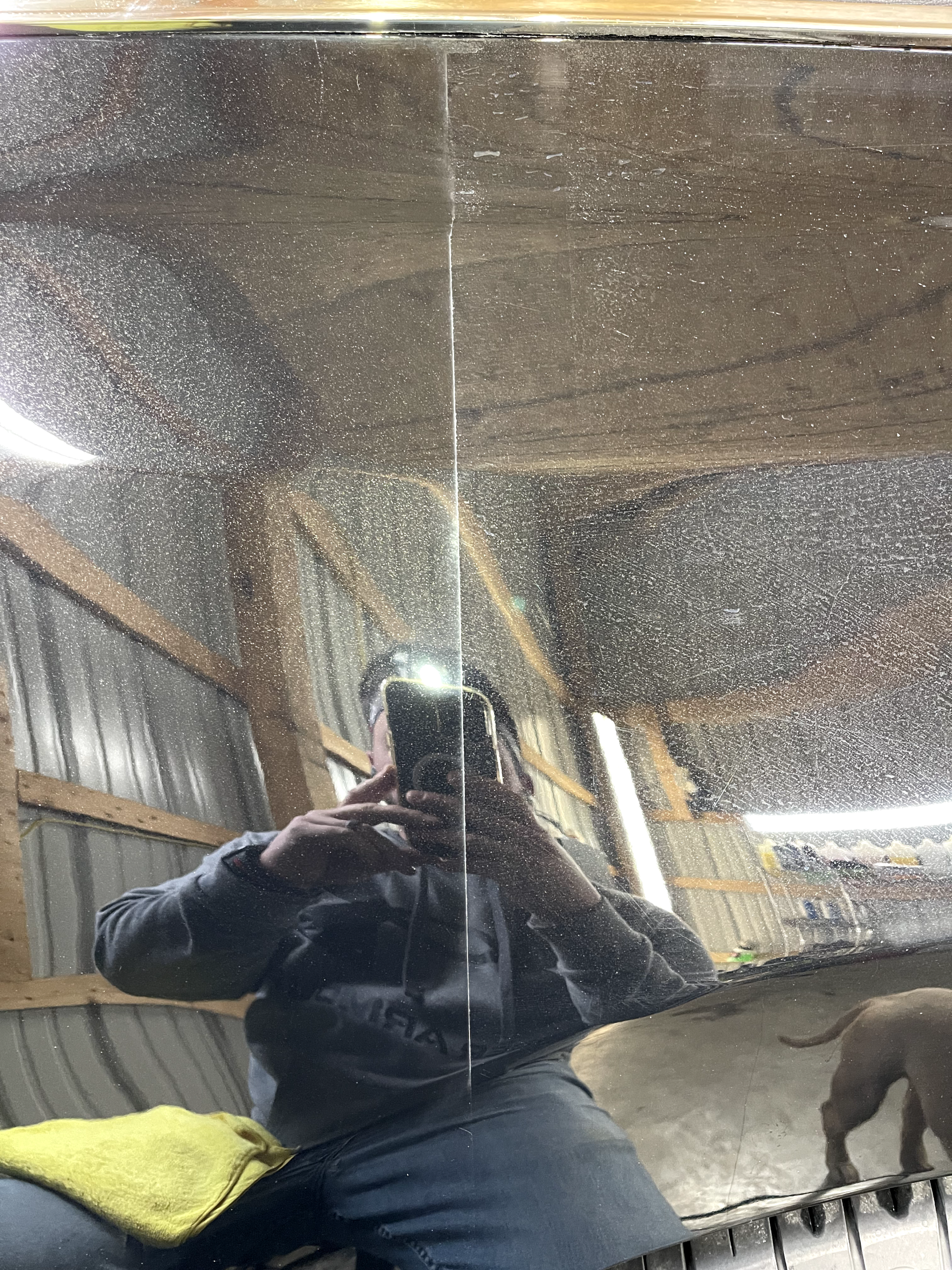a person is taking a picture of themselves in a mirror .