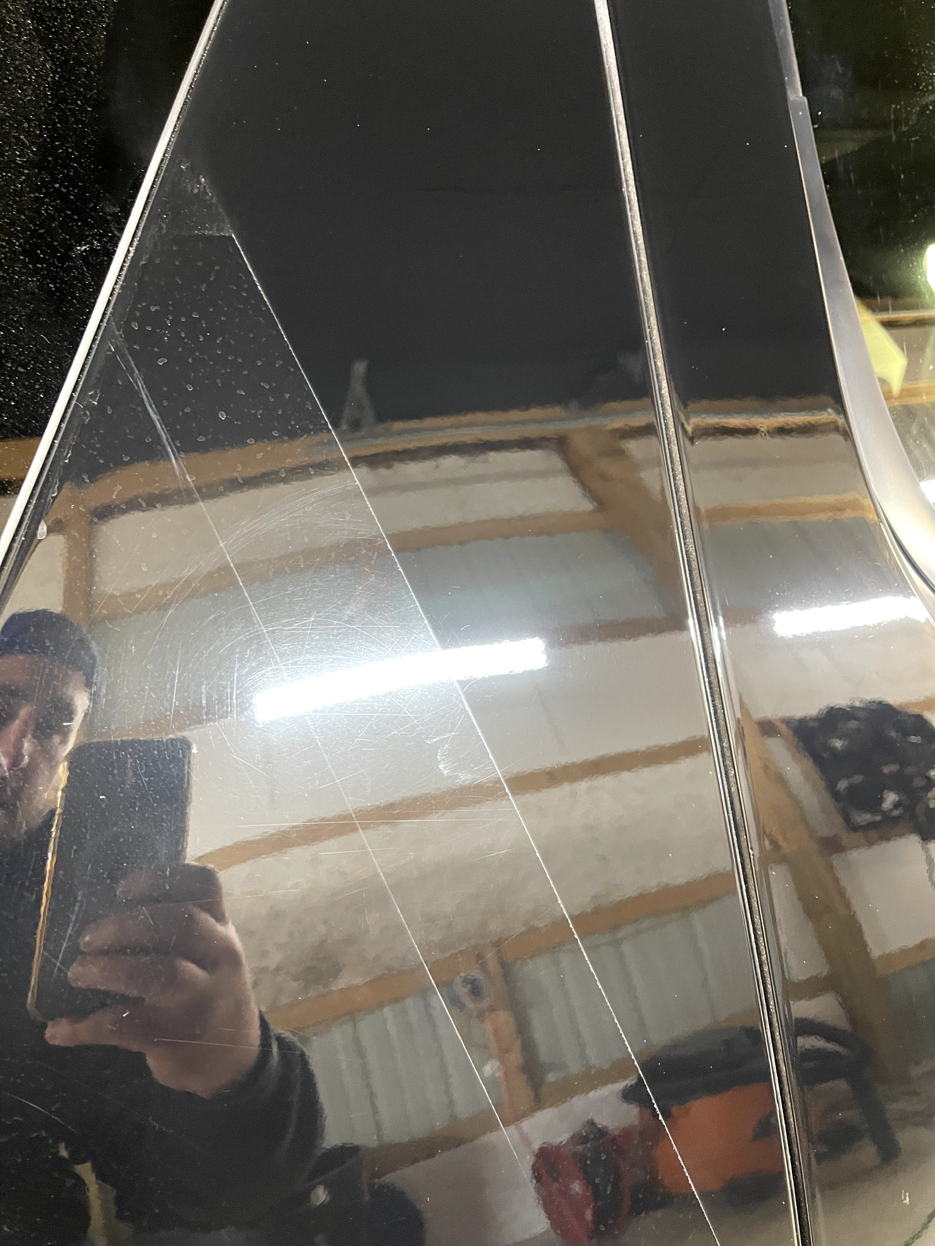 a man is taking a picture of himself in a mirror