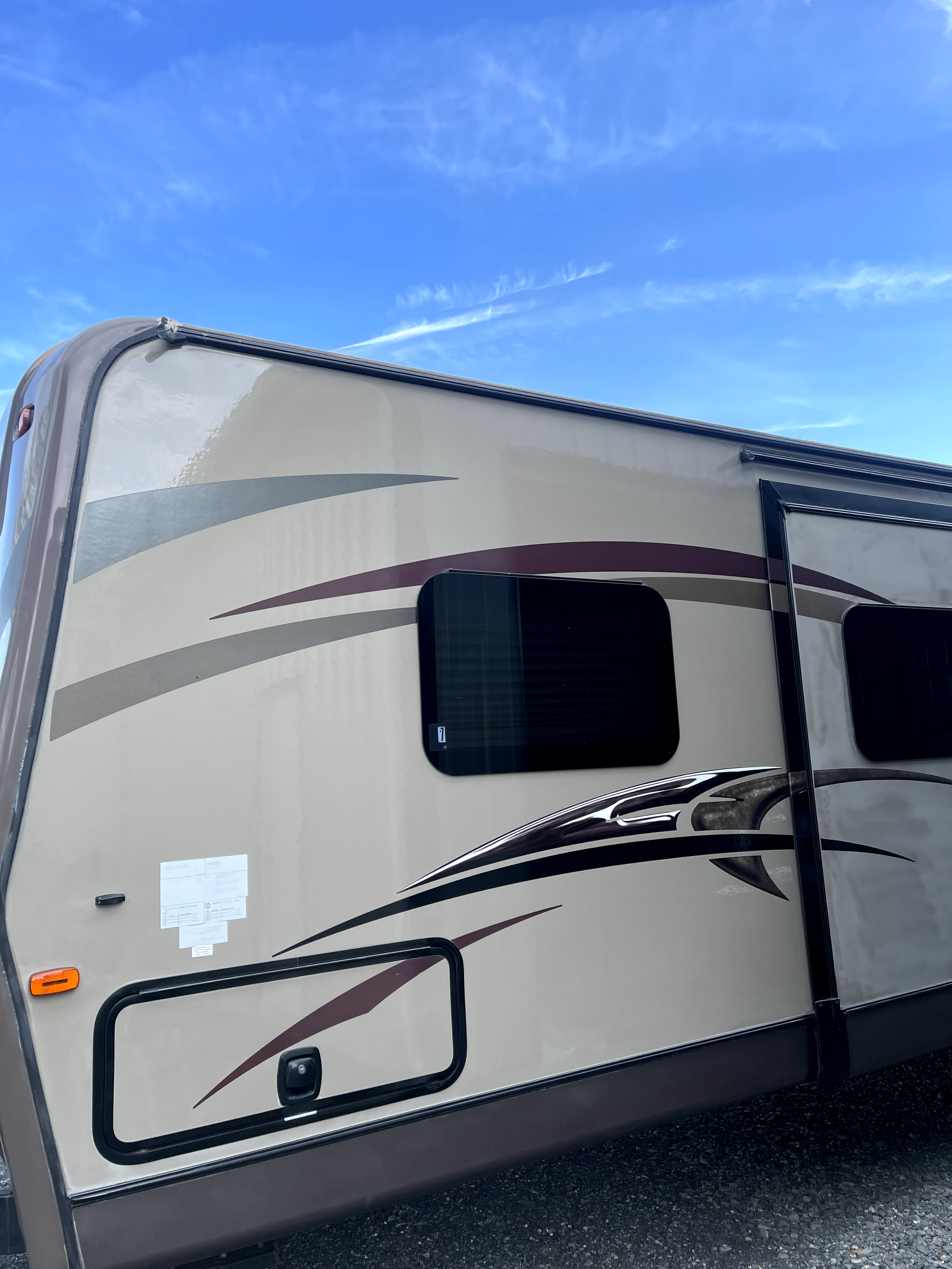 a camper with a blue sky in the background