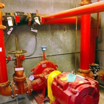 A room with red pipes and a red motor