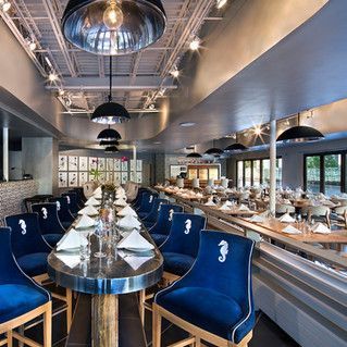 There are many tables and chairs in this restaurant.
