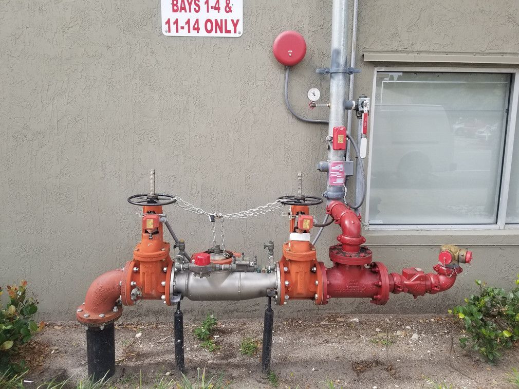 A sign on the side of a building says bays 1-4 & 11-14 only
