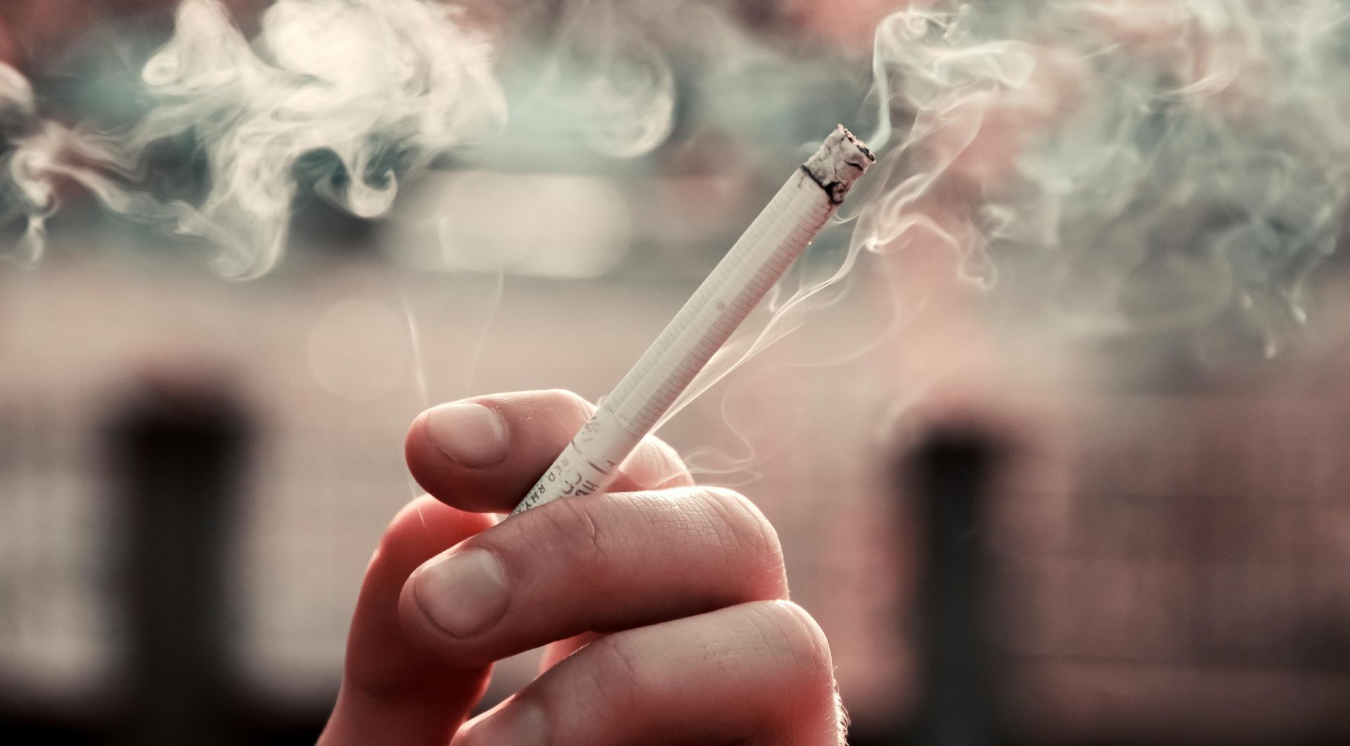 person holding a cigarette