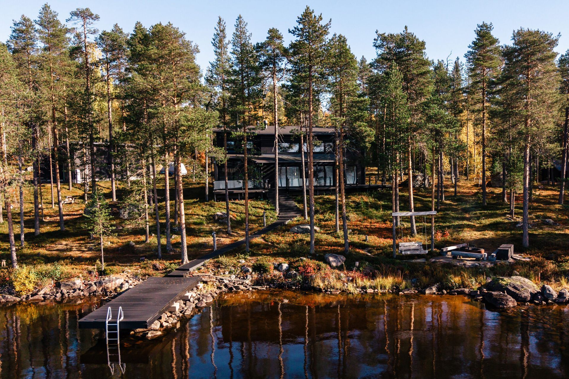 Holiday home among pine trees by a lake outside Rovaniemi