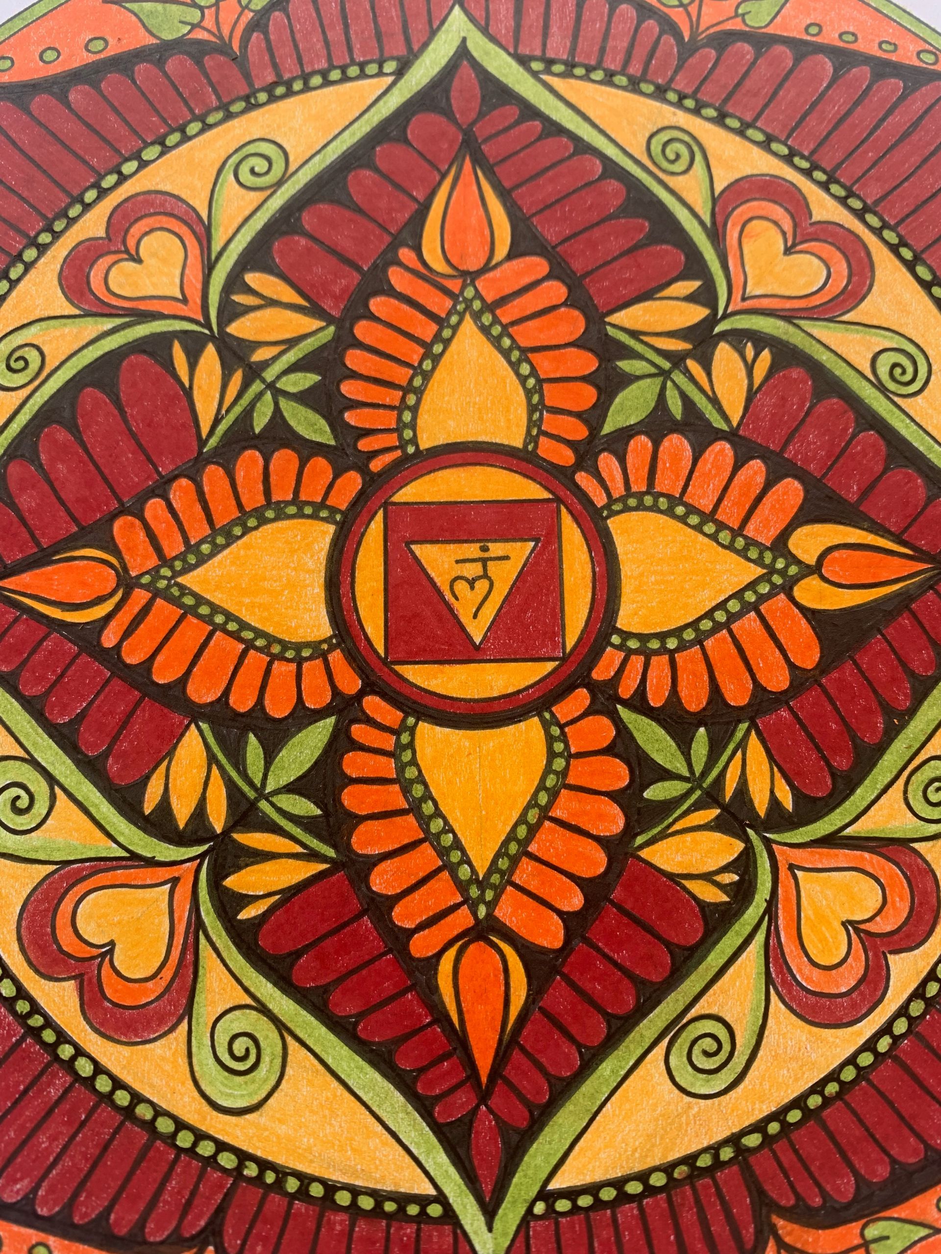 Colorful mandala with floral and geometric patterns, red, orange, yellow, green, and a central symbol.
