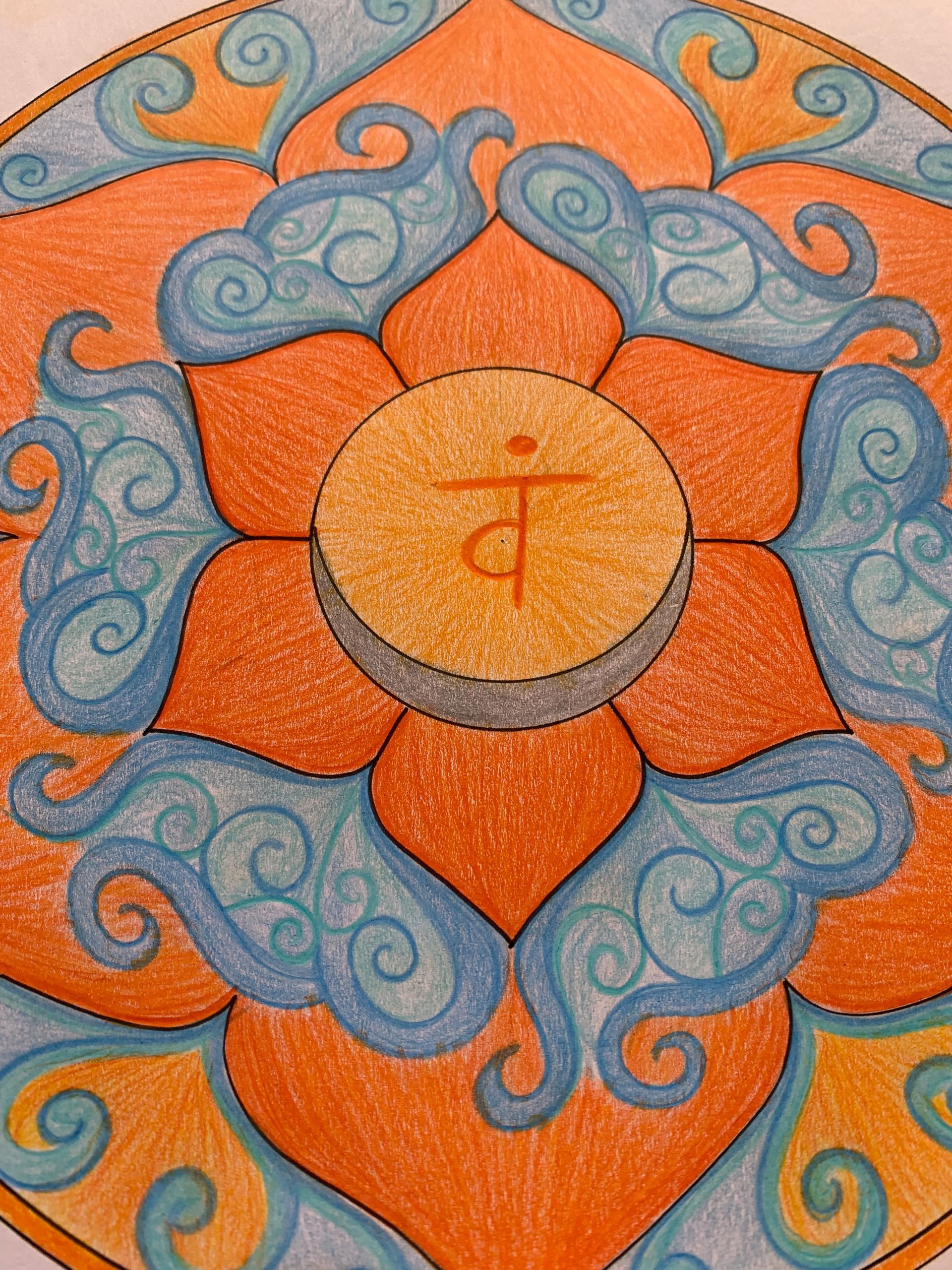 Orange and blue chakra mandala with Sanskrit symbol in the center.