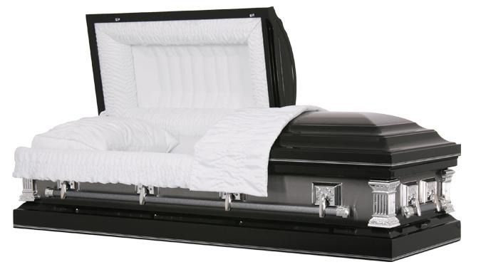 Black-and-silver open casket with white lining and white flowers inside