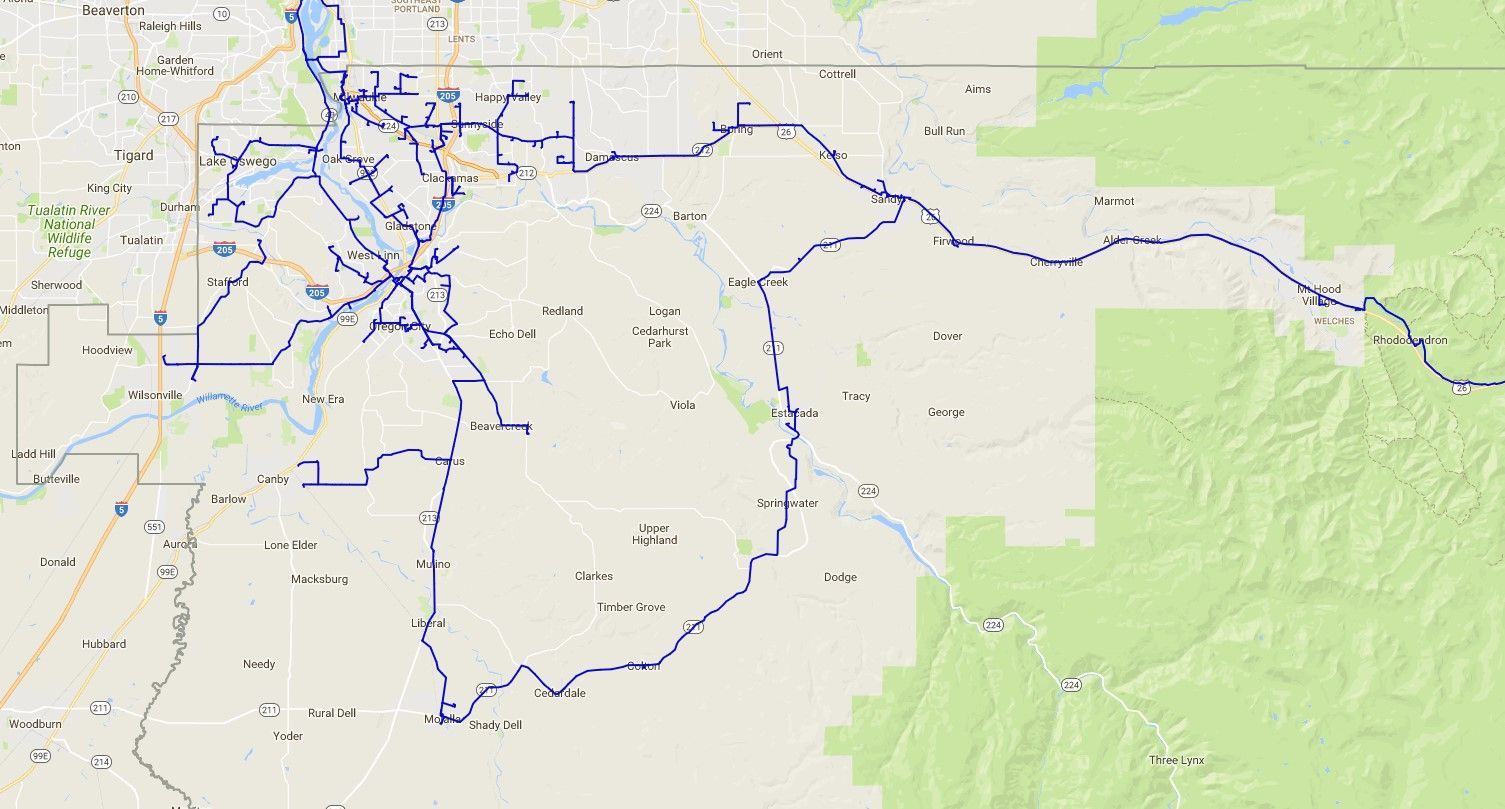 A map of a city with a lot of roads and mountains in the background.