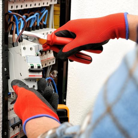electrician cutting a wire with pliers