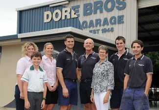 A Group of People Standing in Front of a Garage