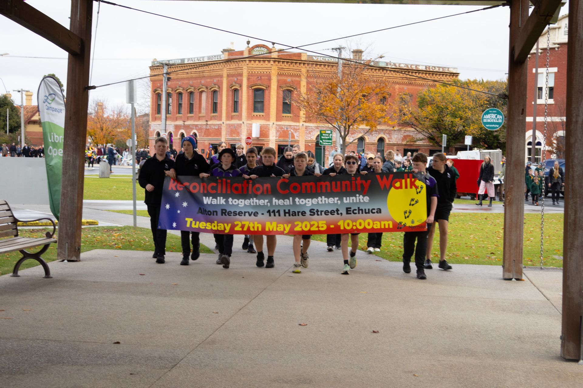 People carrying a banner reading 
