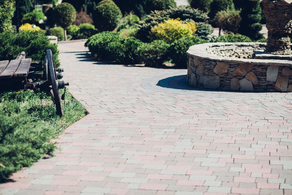 Brick Path in a Garden With Greenery and a Stone-walled Feature — Laurieton Landscape Supplies In Wauchope, NSW