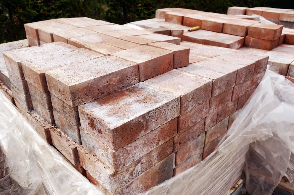 Stack of Red Bricks, Outdoors, Covered — Laurieton Landscape Supplies In Harrington, NSW