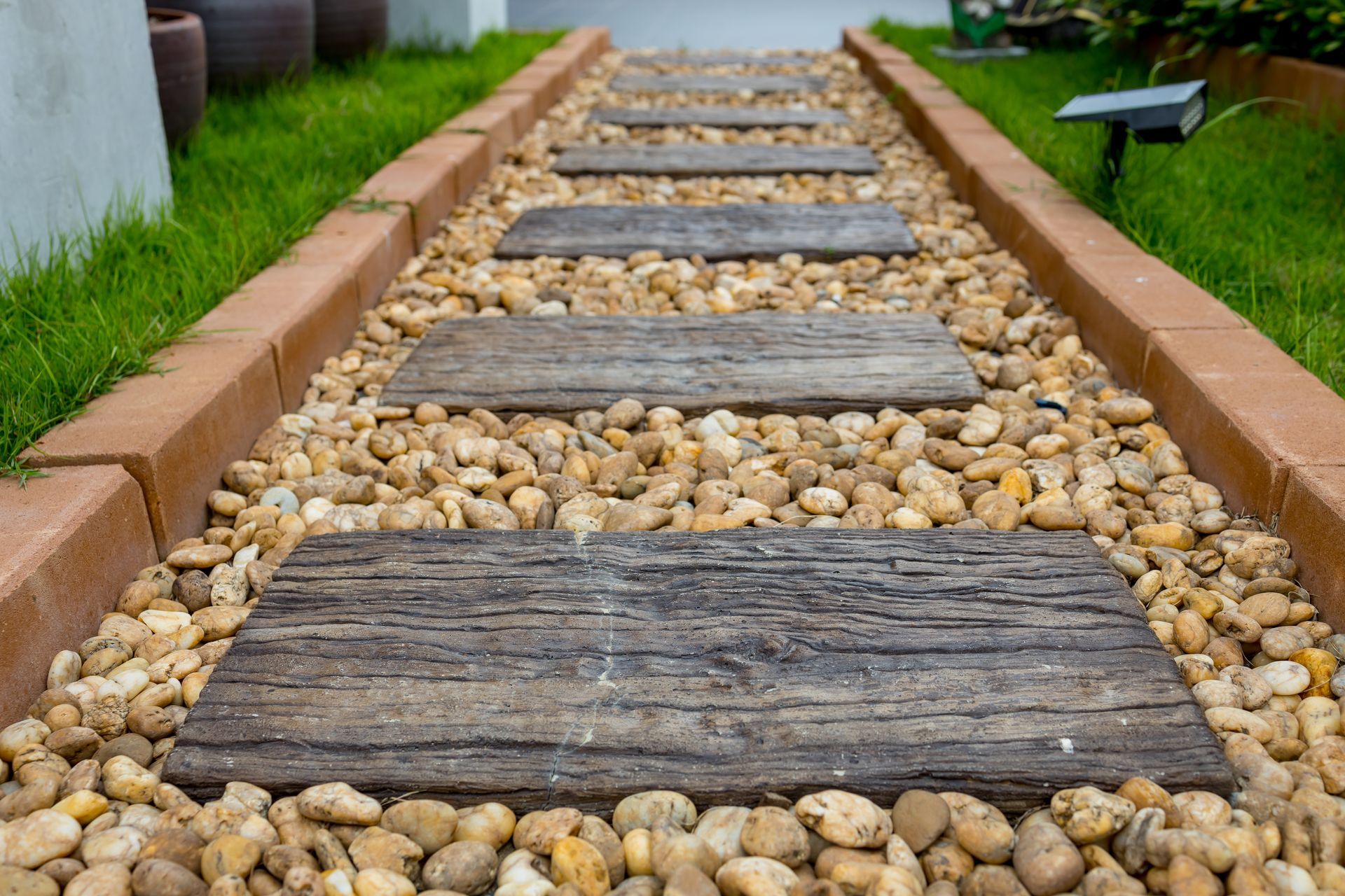 Wooden Stepping Stones on a Gravel Path Bordered — Laurieton Landscape Supplies In Kew, NSW
