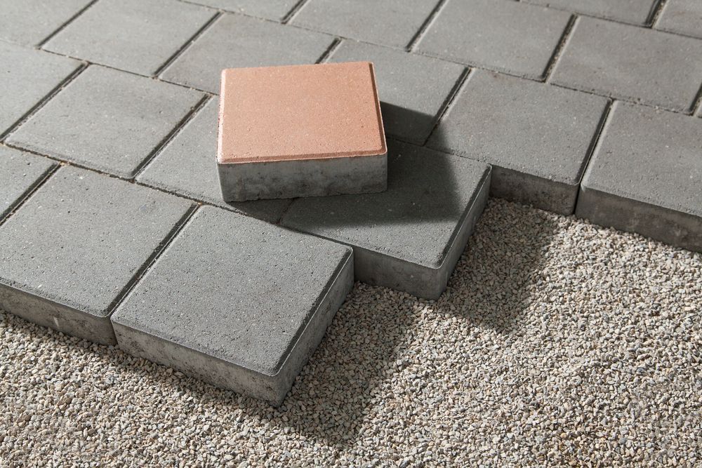 Concrete Pavers Partially Laid on Gravel — Laurieton Landscape Supplies In Bonny Hills, NSW