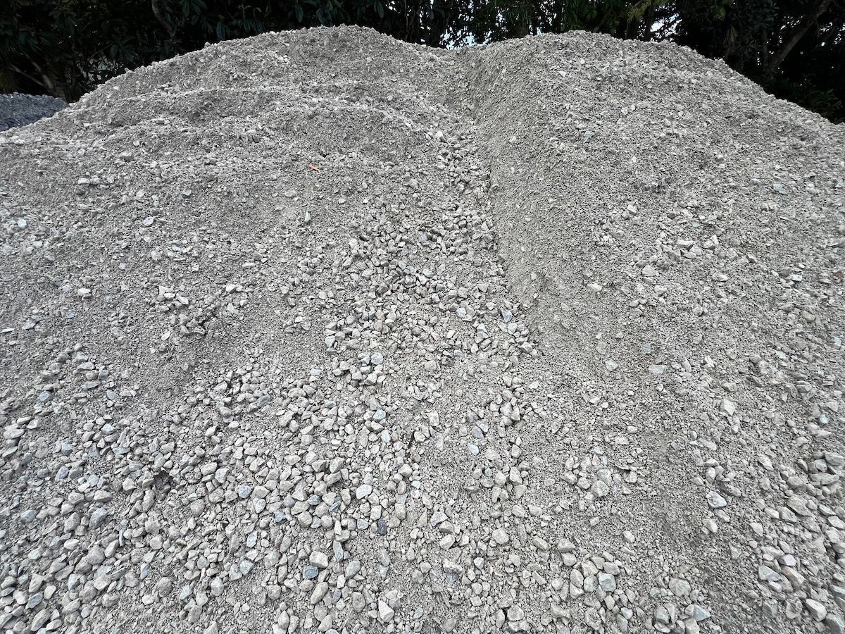 A large, rounded pile of light grey crushed stone or gravel — Laurieton Landscape Supplies In Laurieton, NSW