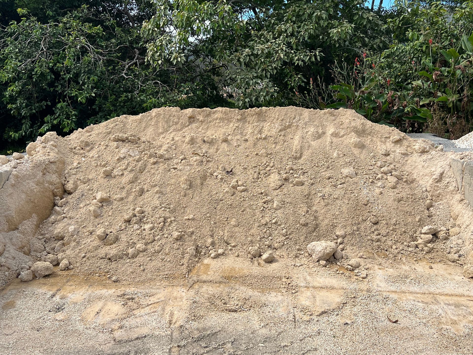 A large, mounded pile of light beige sand and gravel — Laurieton Landscape Supplies In Kew, NSW